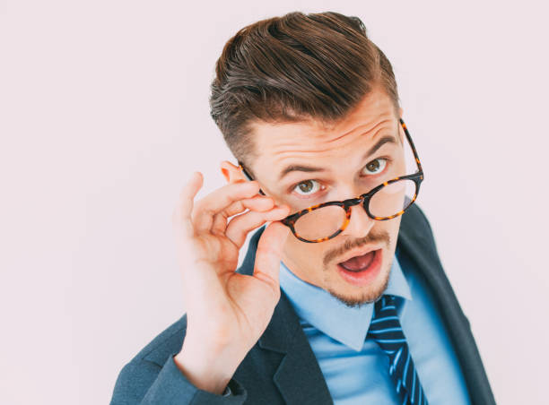 istock Surprised young businessman posing in eyeglasses 811314226
