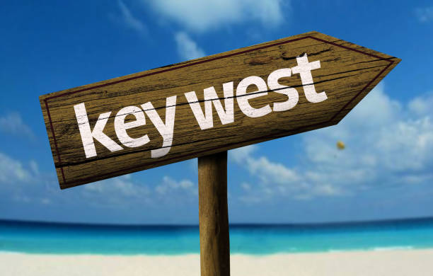 istock Key West wooden sign on the beach 811334356