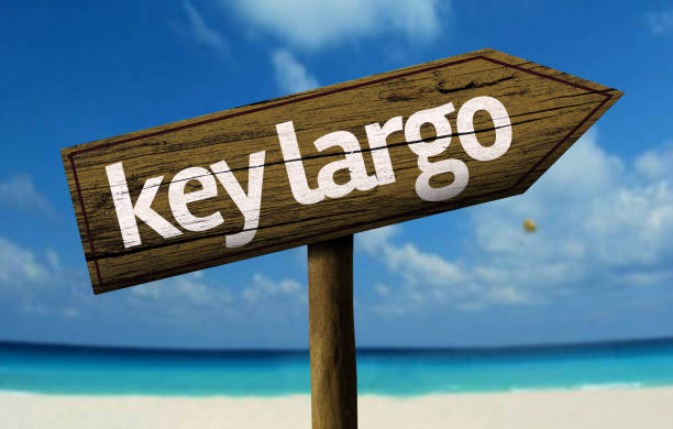 istock Key Largo wooden sign on the beach 811334386