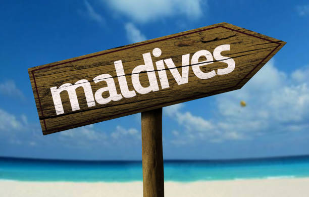 istock Maldives wooden sign on the beach 811334590
