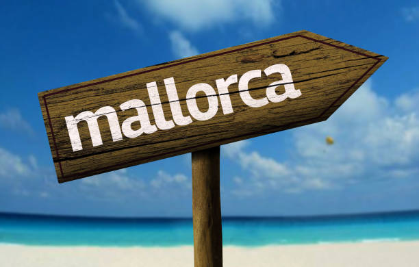 istock Mallorca wooden sign on the beach 811334594