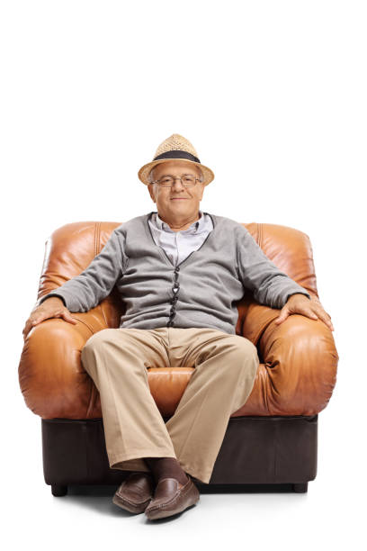 Elderly man sitting in a leather armchair