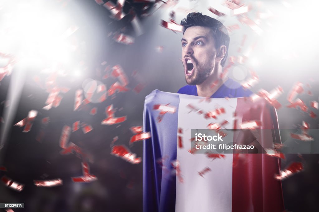 Fan / Sport Player holding the flag of France, celebrating Sport Collection Adult Stock Photo