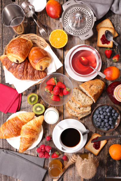 breakfast composition with coffee,tea,croissant and fruits breakfast composition with coffee,tea,croissant and fruits continental breakfast photos stock pictures, royalty-free photos & images