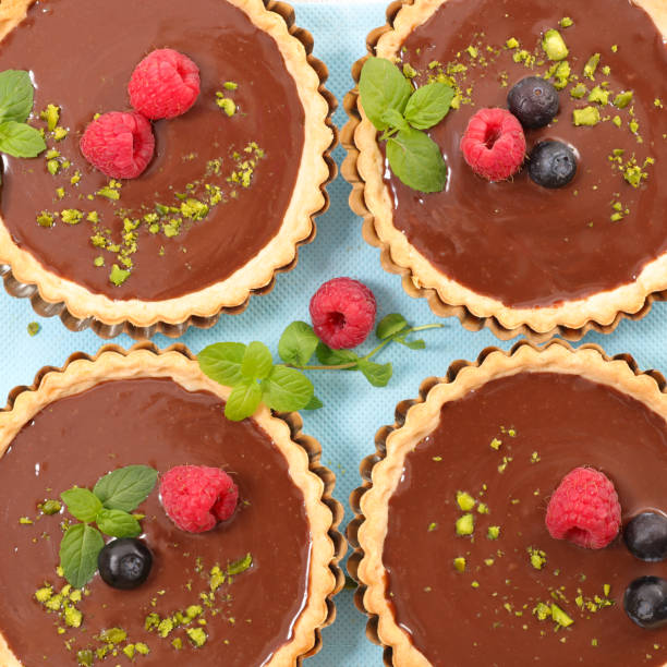 istock chocolate tart with berry fruit 811352970