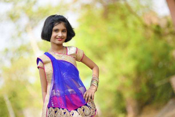 Little Indian girl in traditional sari Little Indian girl in traditional sari beautiful traditional indian girl stock pictures, royalty-free photos & images