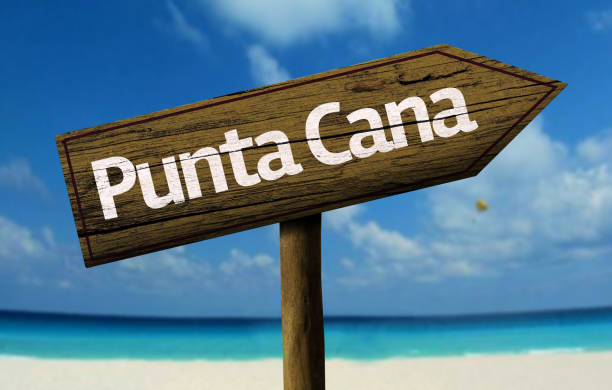 istock Punta Cana wooden sign on the beach 811355632