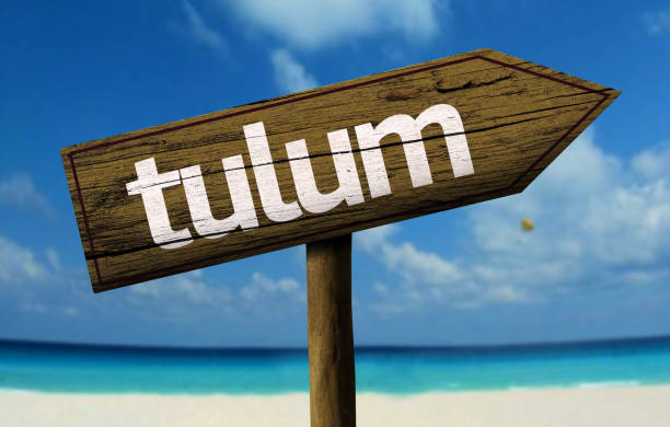 istock Tulum wooden sign on the beach 811355868