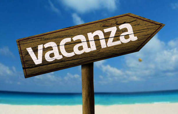 istock Vacation (Italian: vacancy) wooden sign on the beach 811355994
