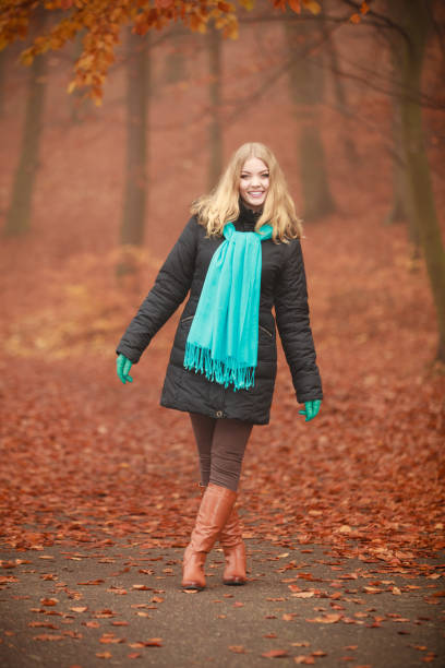 istock Girl is walking through the park. 811360788