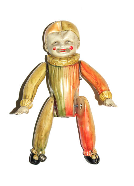 istock Antique Toy Clown Doll on Black Background 811385122