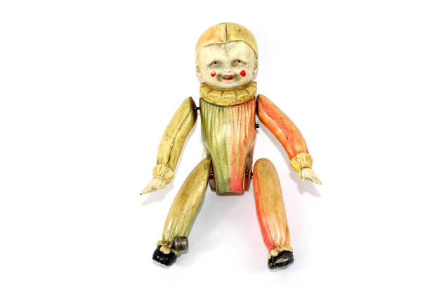 istock Antique Toy Clown Doll on Black Background 811385240