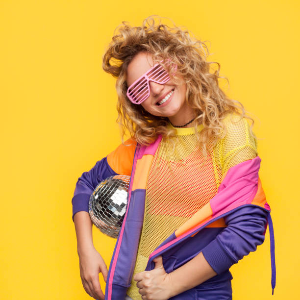 istock Girl in shutter glasses holding disco ball 811388176