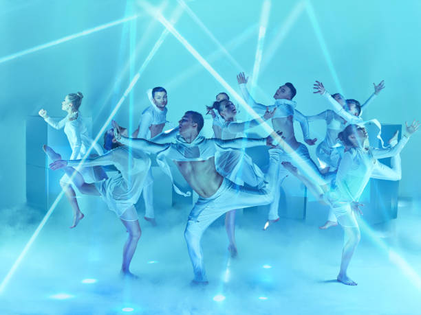 The group of modern ballet dancers The group of modern ballet dancers on blue studio background acrobatic gymnastics stock pictures, royalty-free photos & images