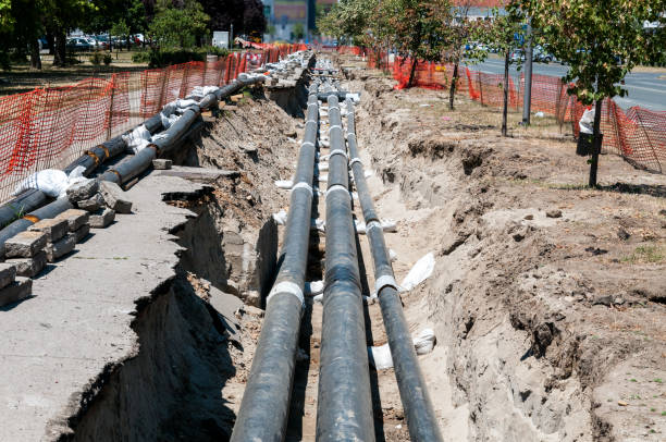 istock District heating pipeline reparation and reconstruction parallel with the street. Selective focus. 811393726