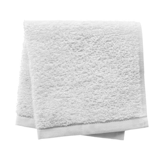 White folded towel White folded towel isolated on white background towel stock pictures, royalty-free photos & images