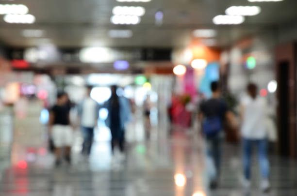 istock People walking in a department store 811403676