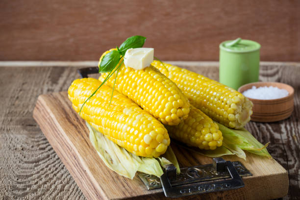 istock Homemade boiled corn on cob with butter and salt 811410408