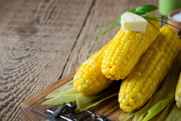 istock Homemade boiled corn on cob with butter and salt 811410428
