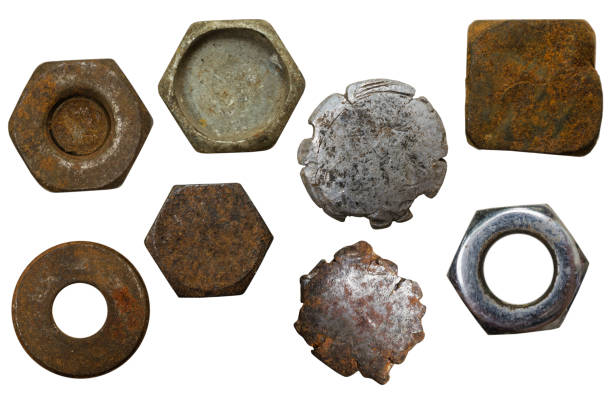 istock Many metallic screw heads, nuts, rivets isolated on white background 811415302