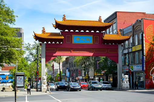 Montreal, Canada - June 15, 2017: The paifang gate at the entrance of the Chinatown neighborhood in downtown Montreal.