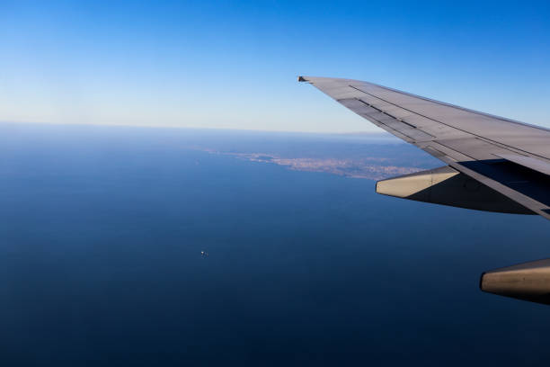 istock Scenery outside window where airliner wings are visible 811420698