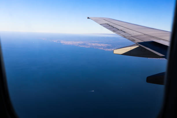 istock Scenery outside window where airliner wings are visible 811420702