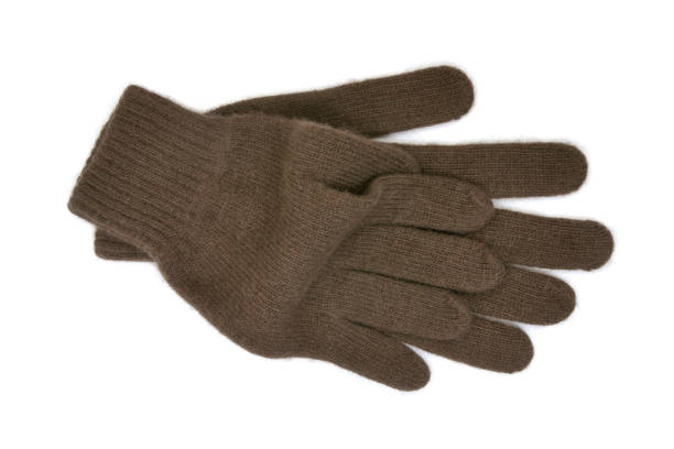 istock Warm brown woollen gloves isolated on white background 811420772