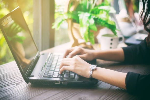 istock Asian business women using notebook and  typing for working 811423220