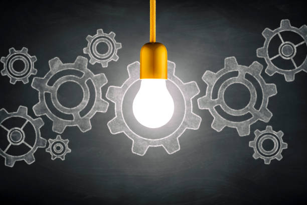 istock Light bulb and gears on blackboard - Vintage Ideas Grunge 811427410
