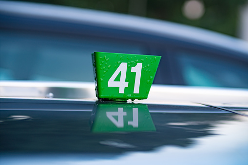 Number 41 plastic sign on motorhood from car in service
