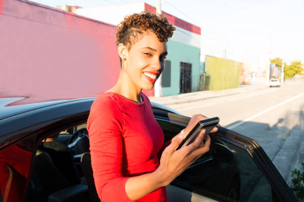 istock Millennial Passenger Exits Car at Destination  Miami USA 811441896