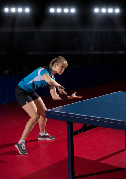 istock Young woman table tennis player 811442050