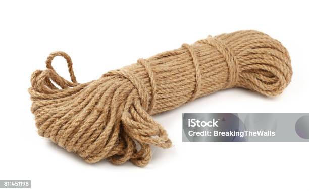 Two small coil bobbin of natural brown twine hessian burlap jute rope over  white background Stock Photo - Alamy