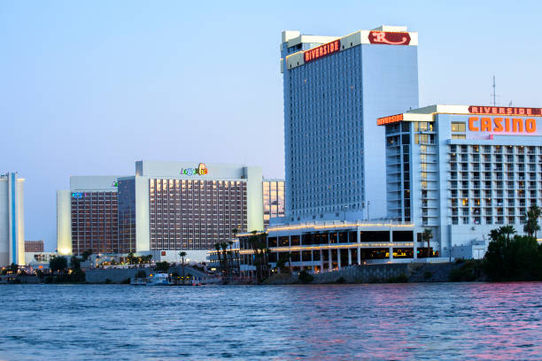 Laughlin, Nevada, USA - July 01,2017 :  Colorado River with water jet skis on a hot summer day at Laughlin, Nevada  USA with casino buildings across the river. Laughlin is located at southern most tip of Nevada state on Colorado river and famous for night life and water sport and attract people from nearby states such as California and Arizona.