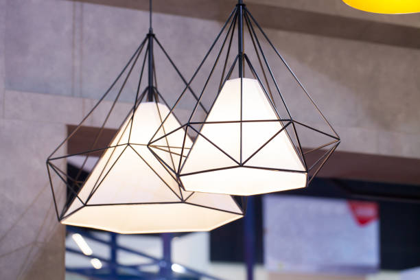 istock Beautiful chandelier. Modern chandelier hanging under ceiling 811462492