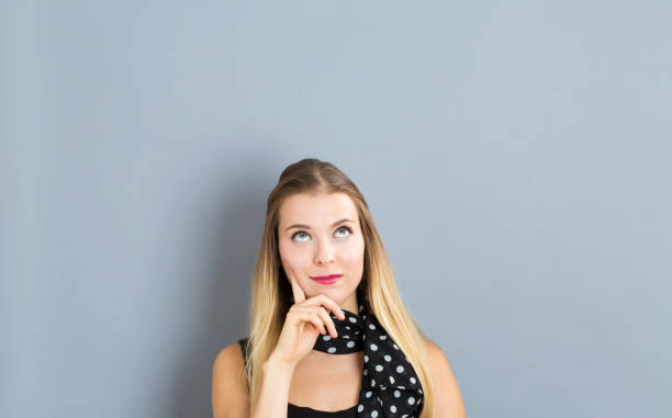 istock Young woman in a thoughtful pose 811470742