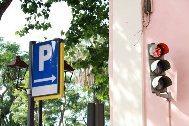 istock Red traffic light and indicative parking sign 811478618