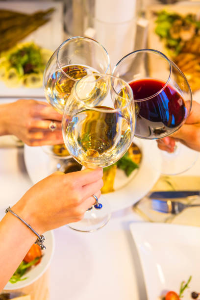 istock Served table with dishes from meat, chicken and fish with wine and whiskey. Romantic dinner in the restaurant by candlelight 811489954