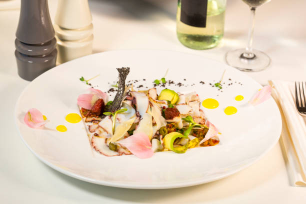 istock Salad from avocado with octopus and parmesan cheese. 811492492
