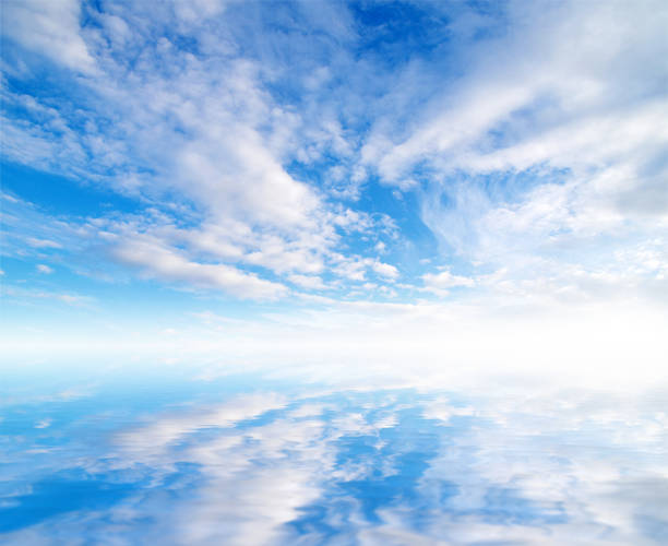 istock white fluffy clouds with rainbow in the blue sky 811500604