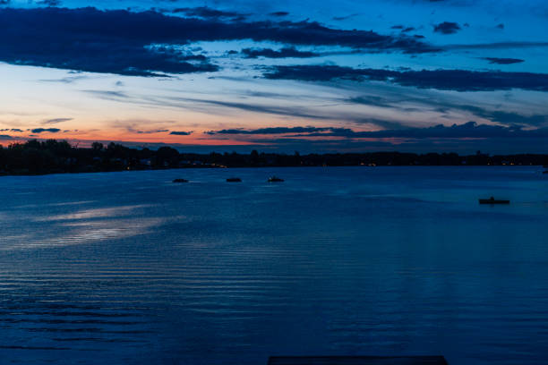 istock sunset on a lake with a pier and a dramatic sky - Neufelder See 811500710