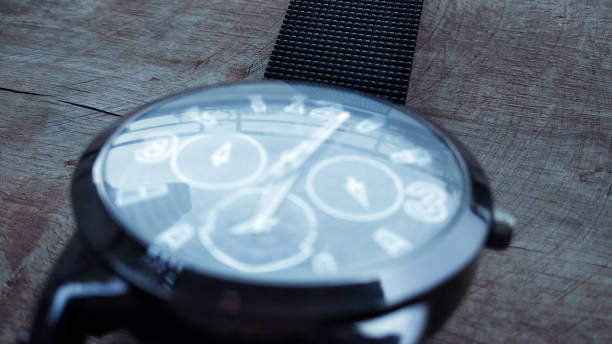 istock stylish hand watch on dark shed wood background 811519096