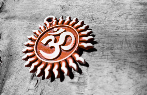 om pendent on wood texture background and greeting