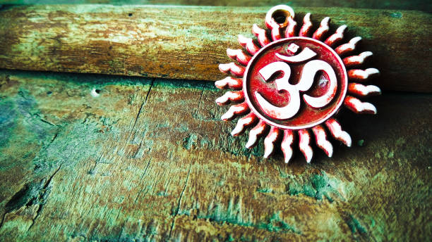om pendent on wood texture background and greeting