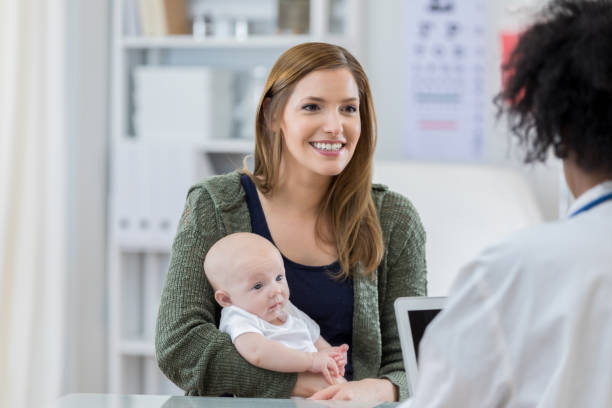 istock Confident mom talks with her child's pediatrician 811544592