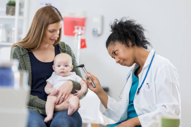 istock Pediatrician looks in baby's ear 811544716