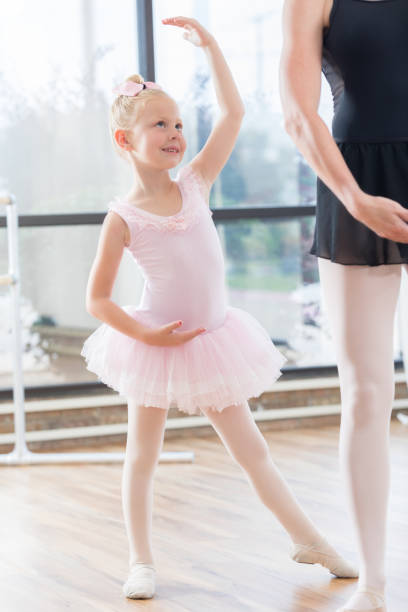 istock Graceful ballerina practices for recital 811544890