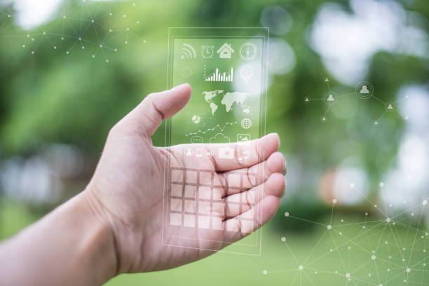 istock A man using the transparent phone with the future technology . Technology concept, future and futuristic technology. 811545028