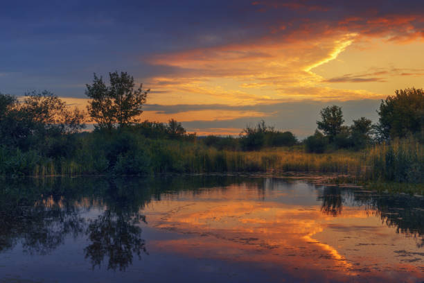 istock Landscape with beautiful sky reflection in river during sunset 811558312